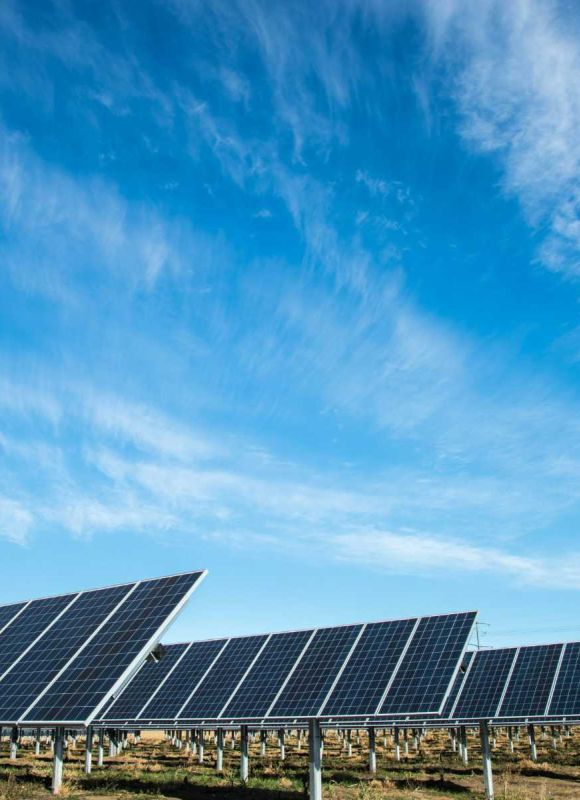 Rows of solar panels in a field representing Carbon3’s commitment to renewable energy