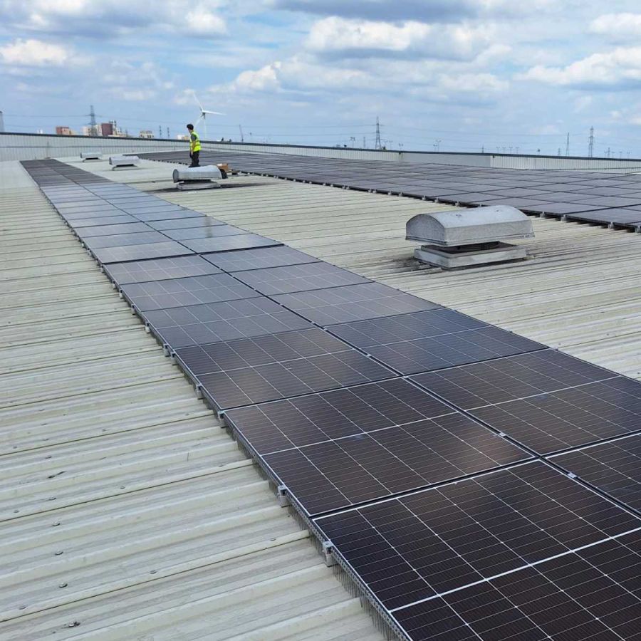Engineers maintaining solar and EV charging at a transport facility
